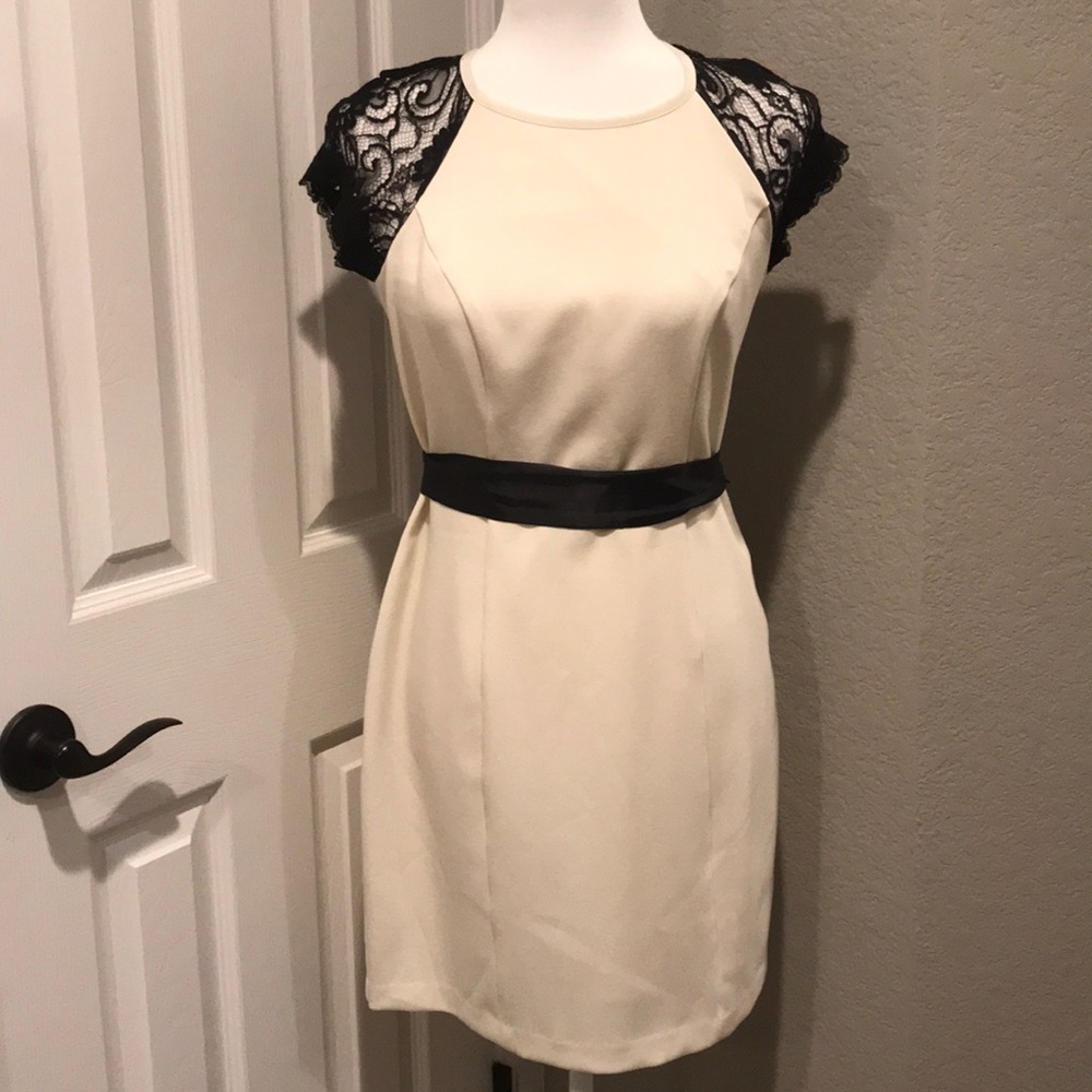 Bisou Bisou cream dress with black lace sleeves